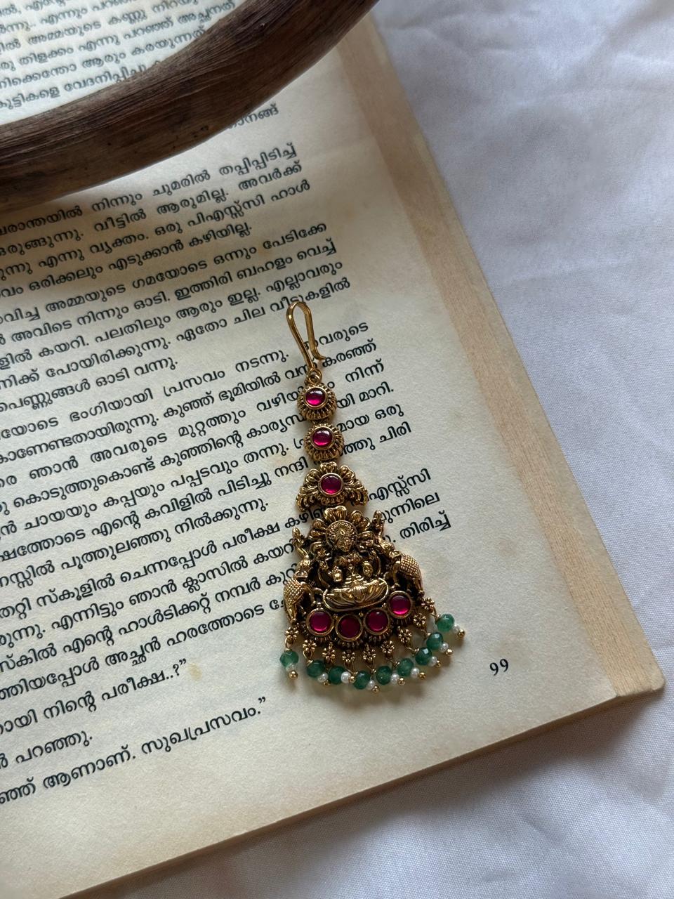 Jadau Kundan Pink Stones Lakshmi Idol With Mint Droppings Maanga Tikka