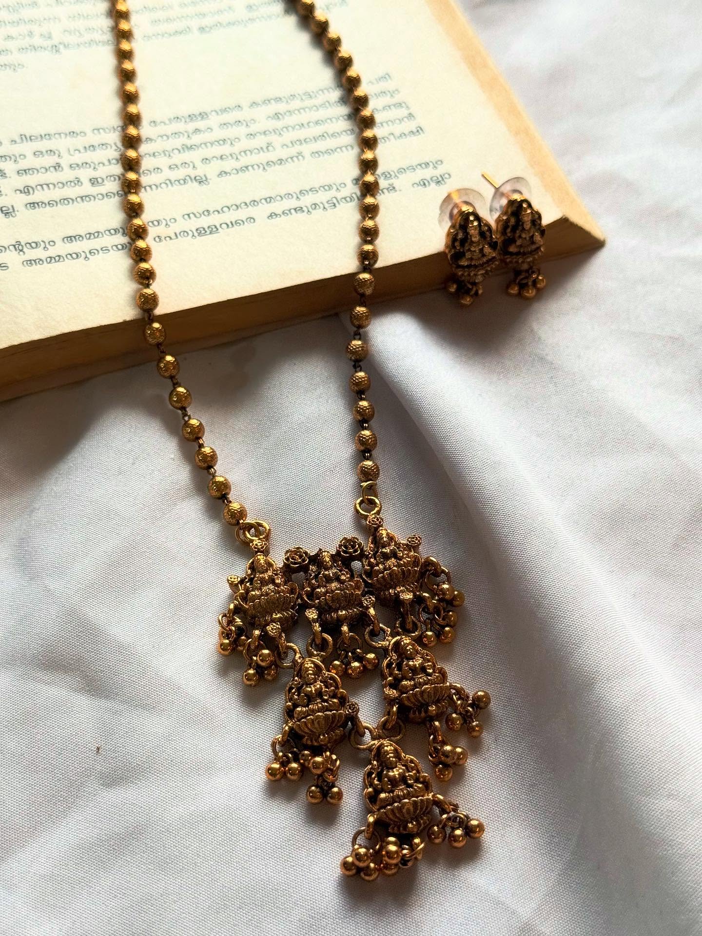 Multi Devi Motif Pendant In Gold Chain Haaram With Earrings