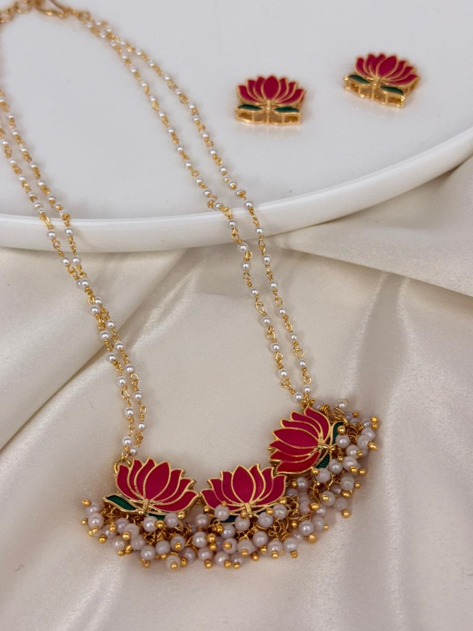 Enamelled Lotus With Ghungroo Drops In Pearl Chain With Earrings