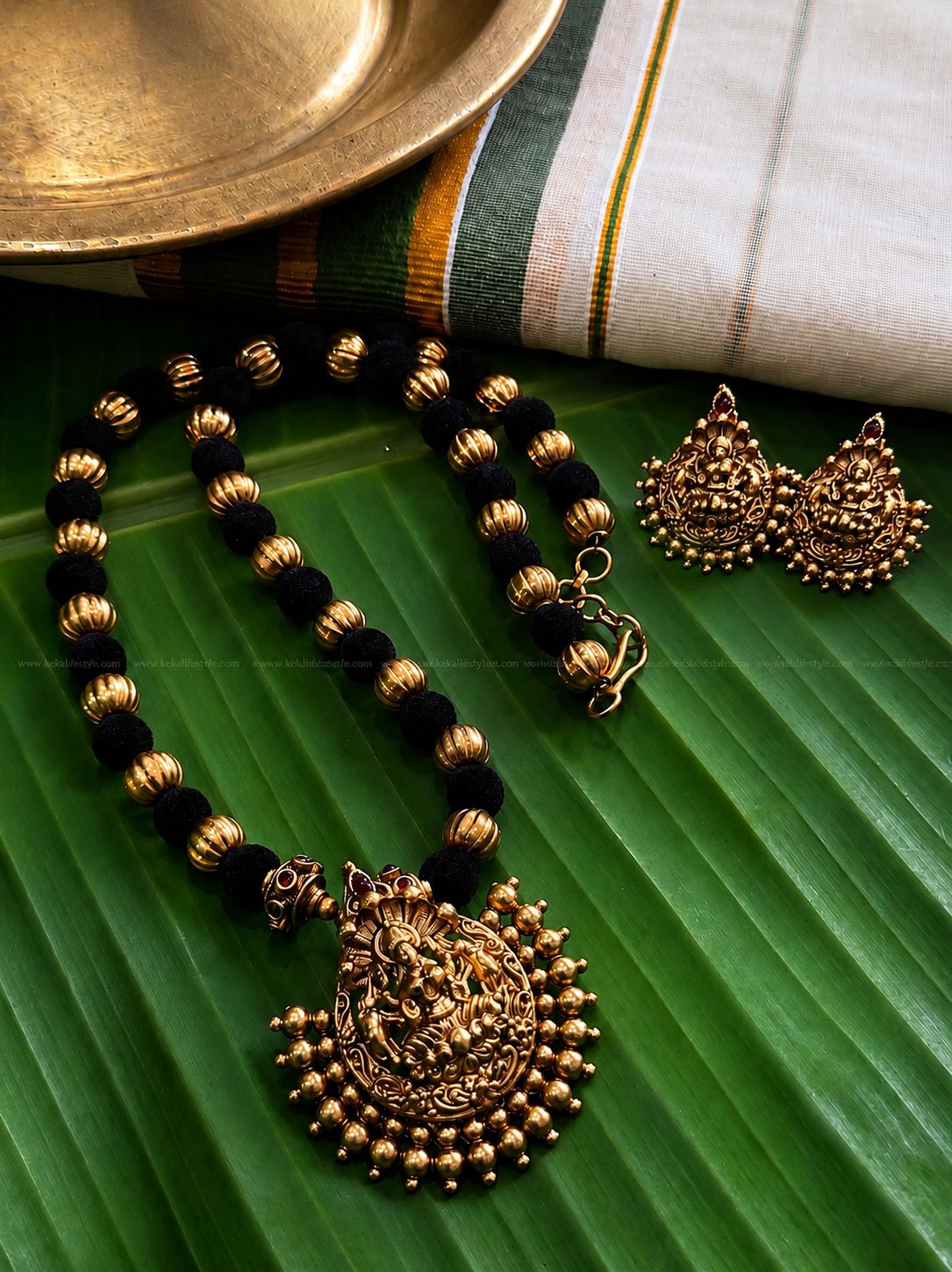Matt finished black-golden necklace with earrings