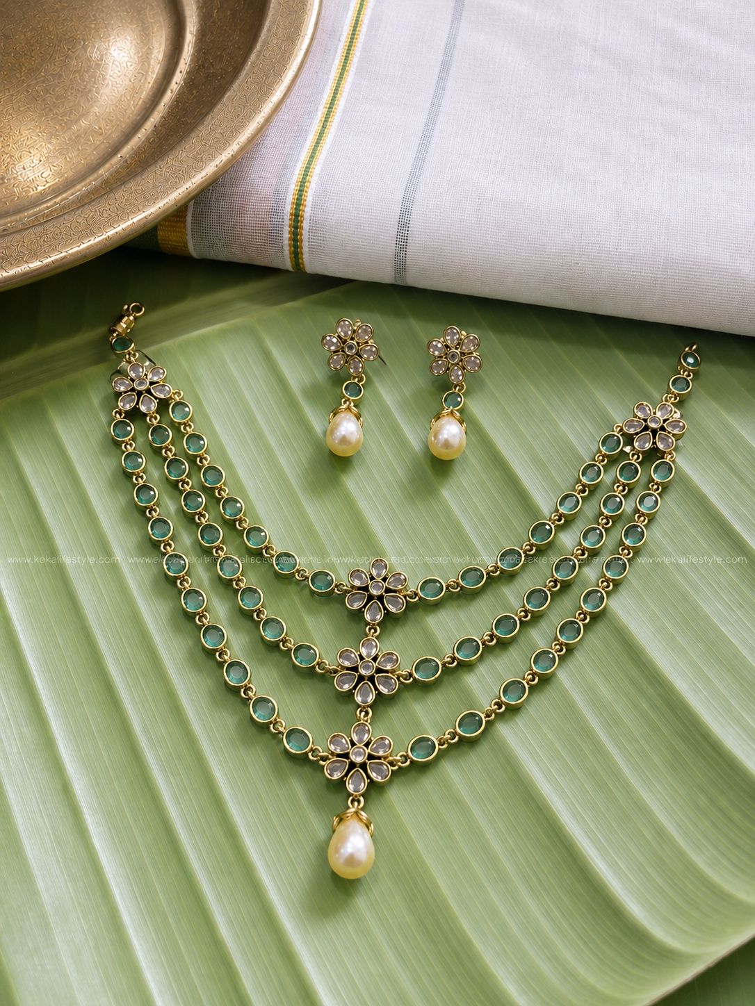 Triple layer pale green stone,flower motif necklace with earrings