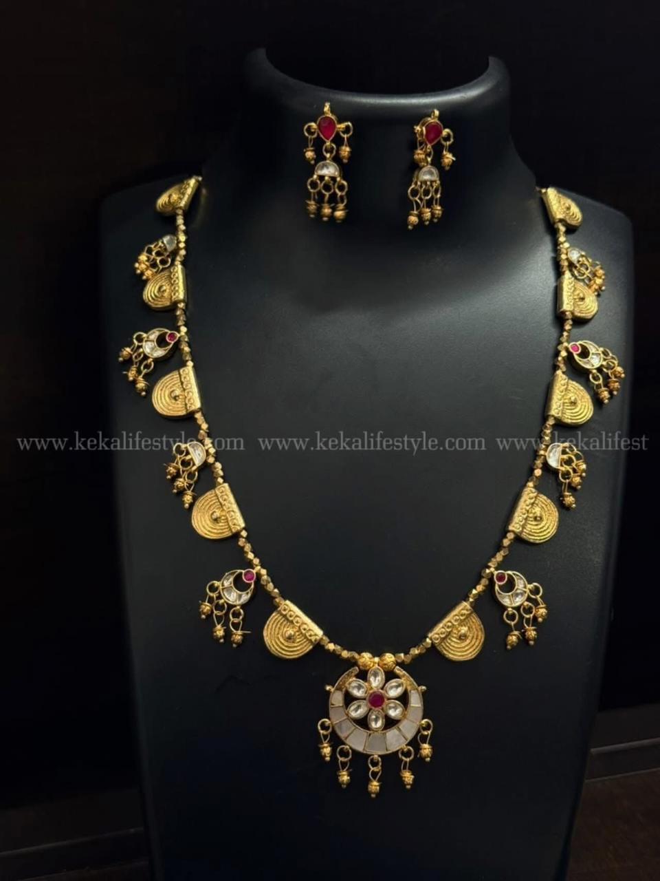 Kundan and brass combination necklace with earrings