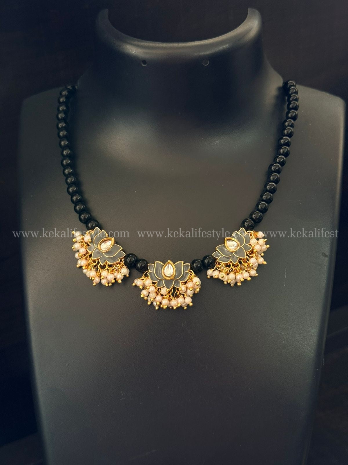 Pearl bunch in lotus with black chain