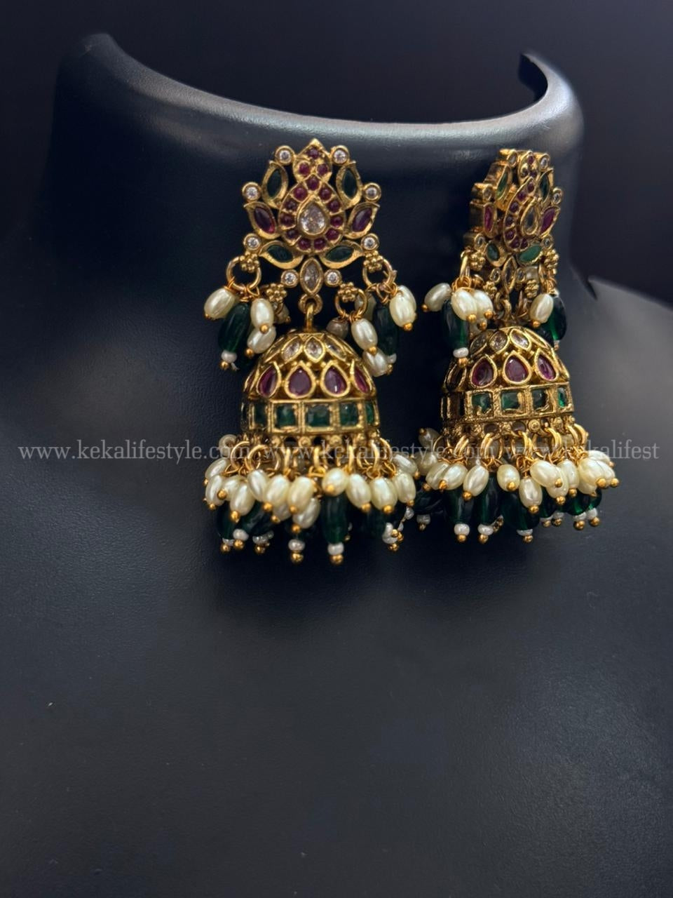 Lotus stud kemp stone jhumkas with green jade and rice pearl hangings