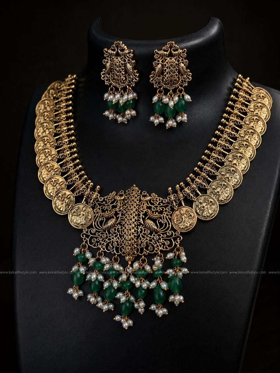 NGN0239 - Heritage-inspired premium coin necklace with intricate handcrafted pendant, green jade bead accents and pearl danglings. Comes as a complete set with earrings.