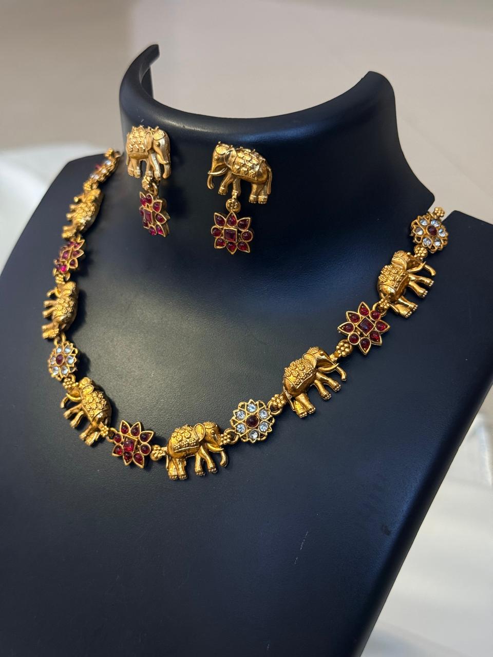 Ruby Flower And Elephant Motif Necklace With Earrings