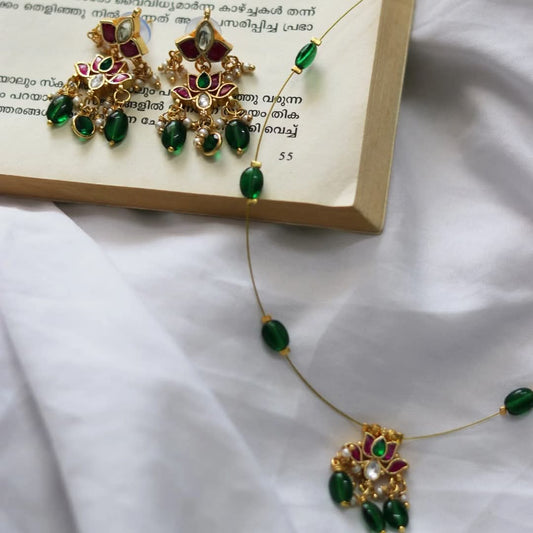 Jadau Kundan Lotus Pendant With Bottle Green Beads As Drops Handmade Necklace With Heavy Lotus Earrings