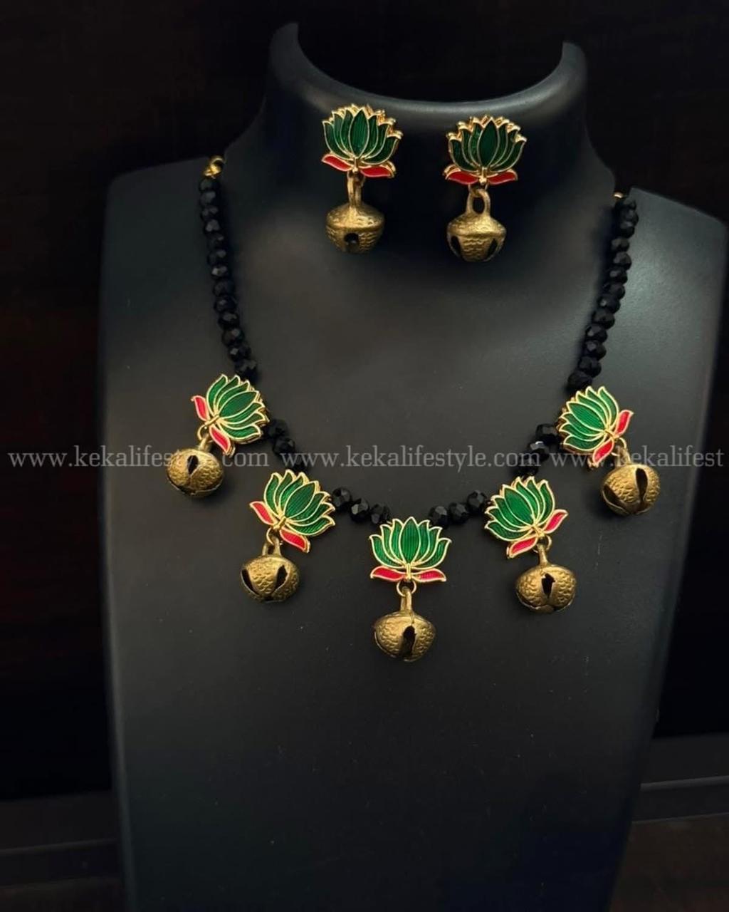 Glass beads with brass ghungroos and enamelled lotus