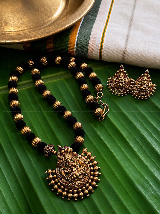 Matt finished black-golden necklace with earrings