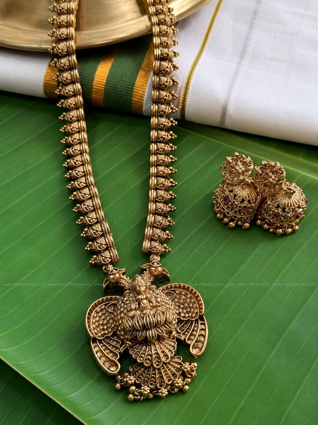 Antique gold matt finished gandaberunda long haaram with earrings