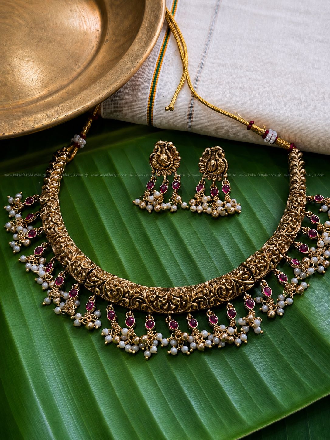 Indricate designed hasli with ruby and pearl drops necklace with earrings