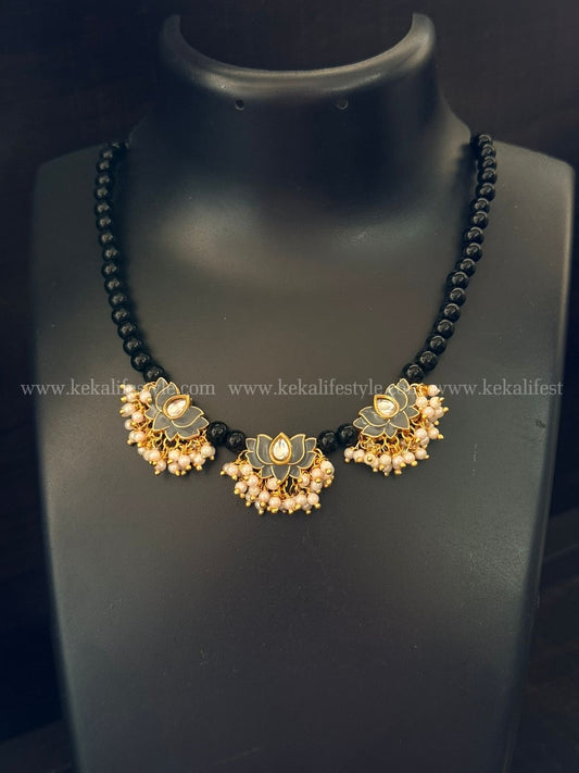Pearl bunch in lotus with black chain