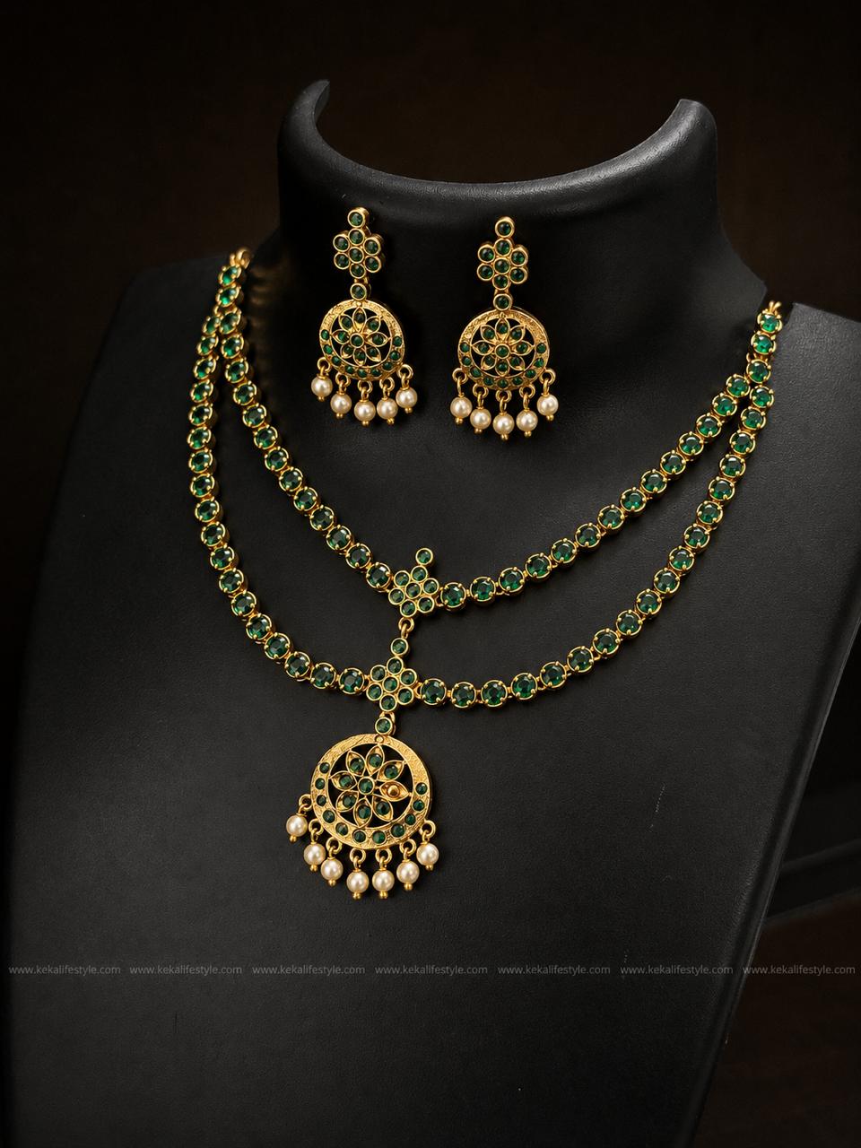 NGN0242 - Heritage-inspired dual-layer emerald green stone attigai with a floral centrepiece and pearl hangings. Comes with matching earrings