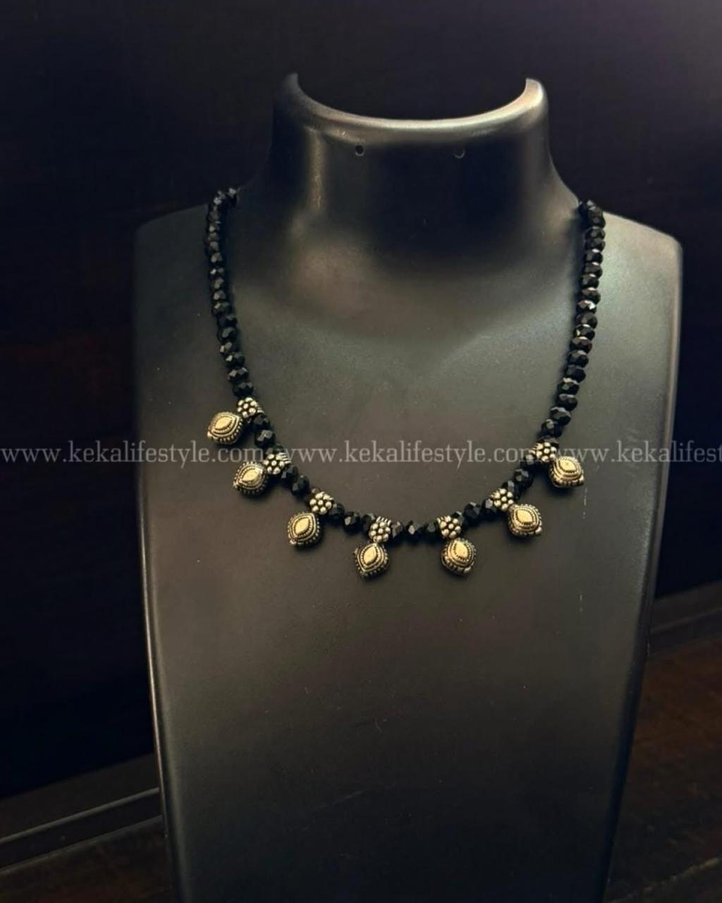 Glass beads with kohlapuri charms
