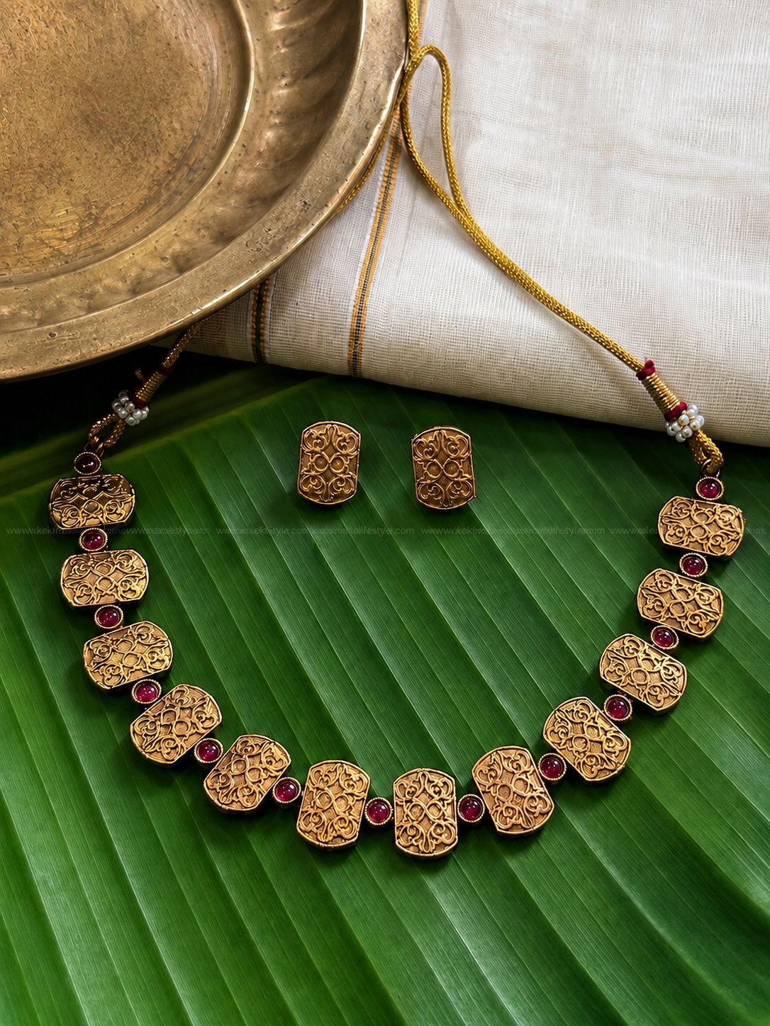 Gold toned ruby traditional necklace with earrings