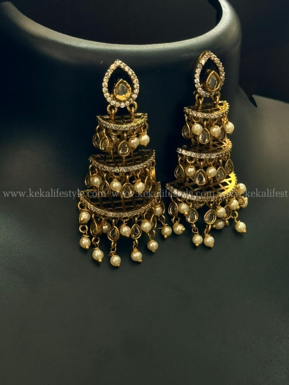 Step jhumka with beads and stones