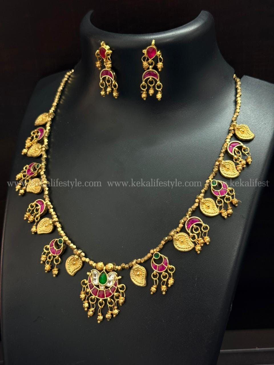Kundan and brass combination necklace with earrings