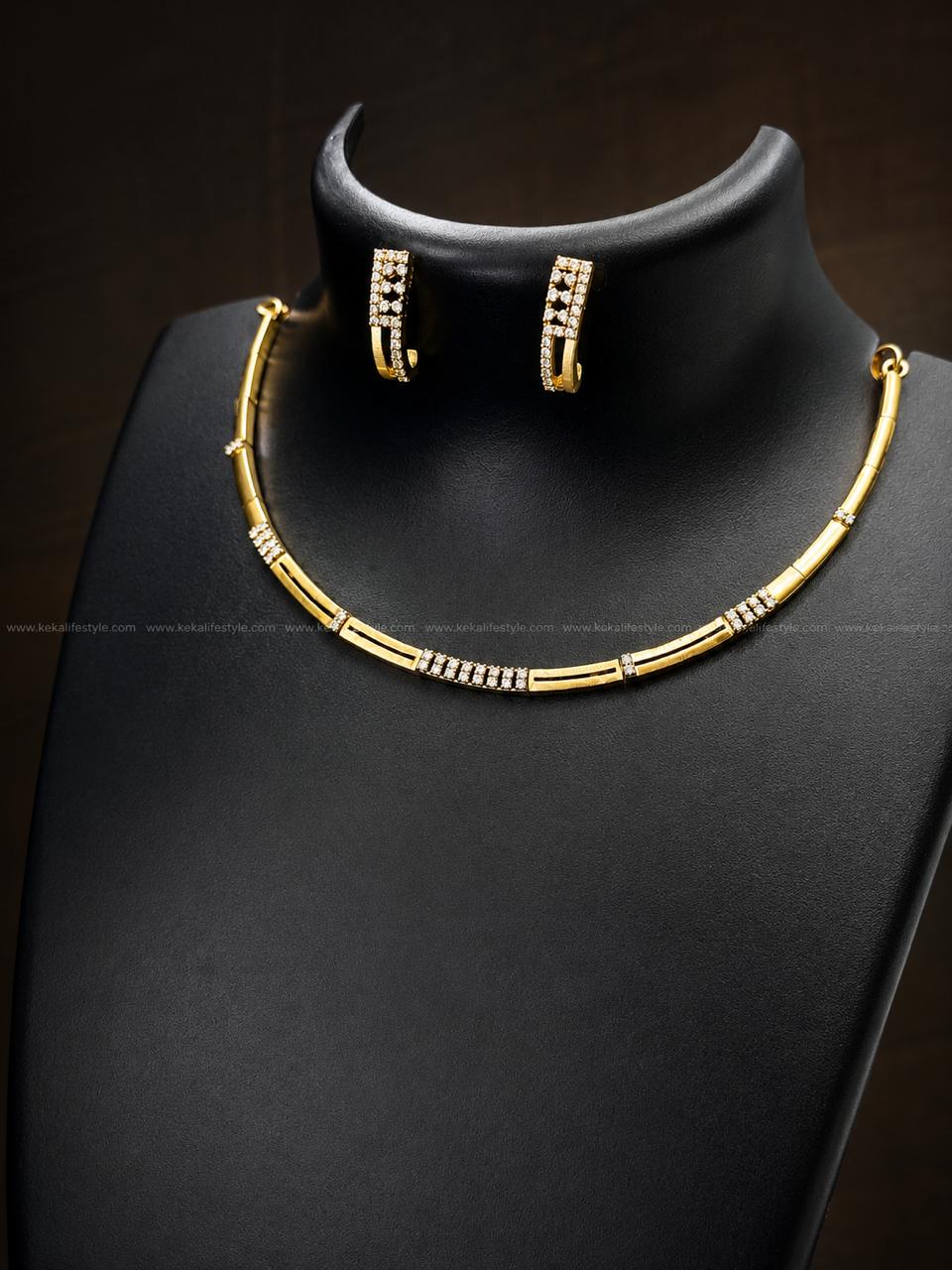 NGN0247 - Premium handcrafted CZ necklace with a sleek modern design and brilliant stone accents. Comes with matching hoop earrings