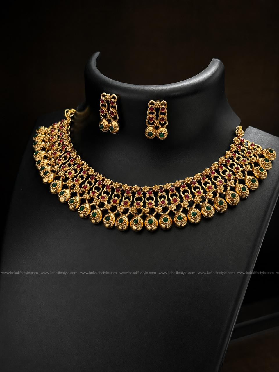NGN0245 - Premium quality antique finish temple necklace with ruby & emerald green stones, intricate floral detailing and matching earrings