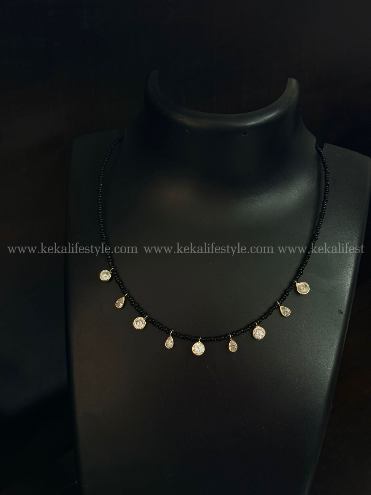 Polki kundan drops in black sugar beads chain