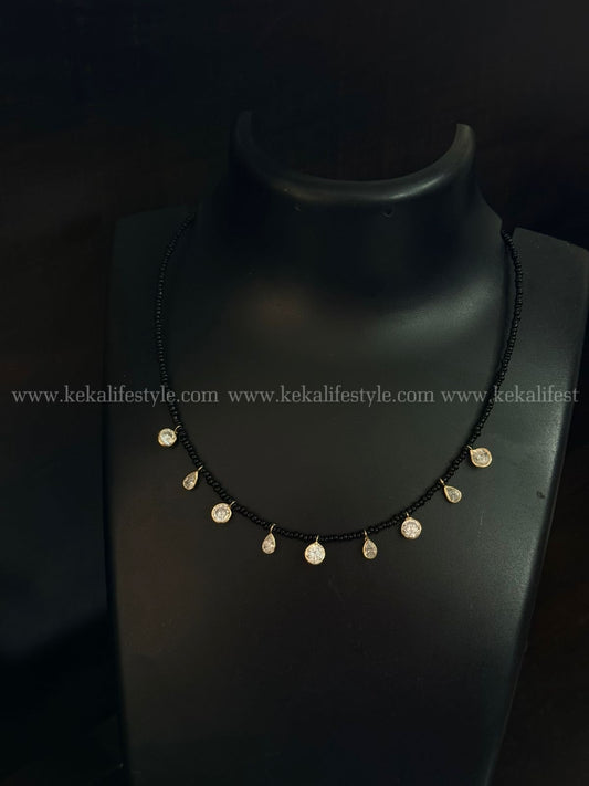 Polki kundan drops in black sugar beads chain