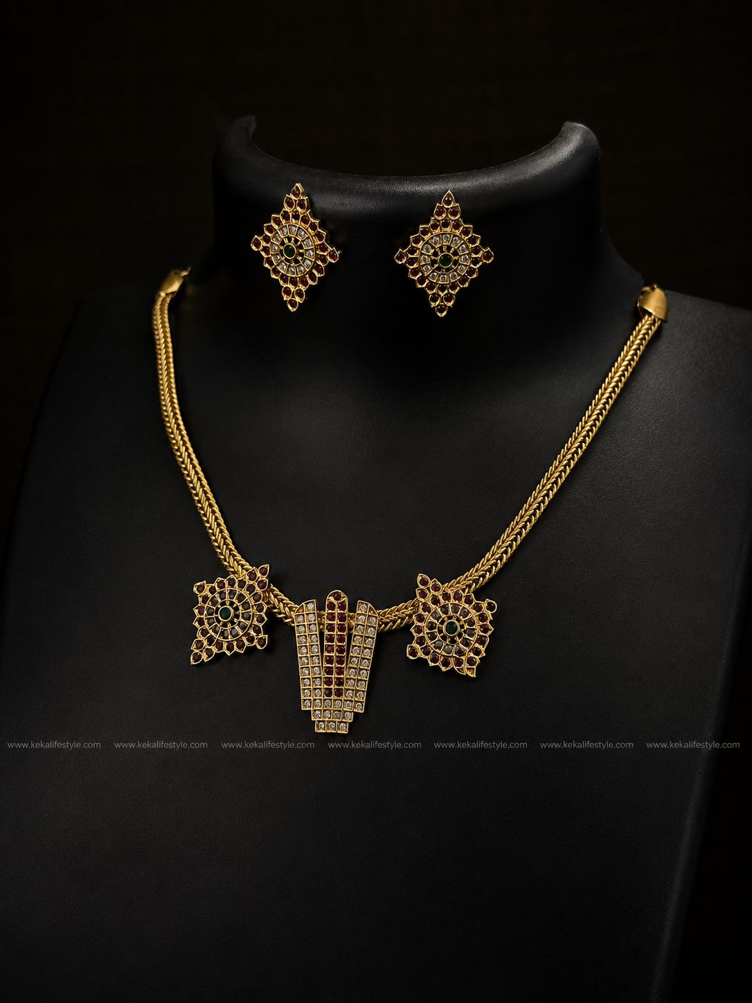 NGN0250 - Premium quality statement necklace with intricate geometric motifs, ruby & emerald stone accents and CZ detailing. Comes with matching earrings
